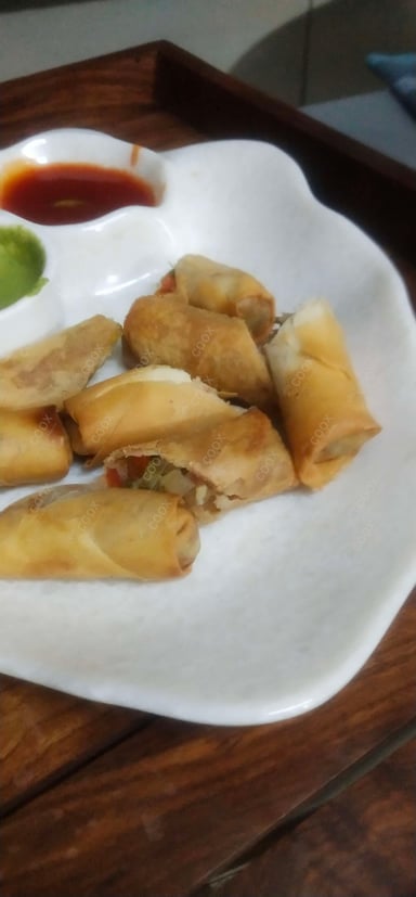 Delicious Veg Spring Rolls prepared by COOX