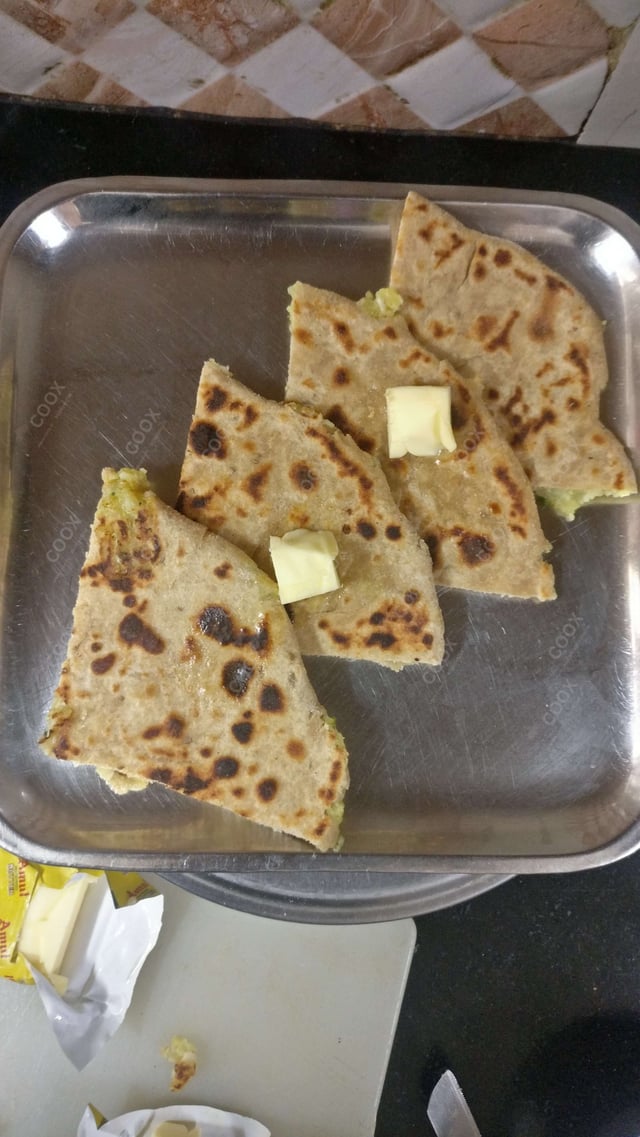 Delicious Stuffed Parathas prepared by COOX