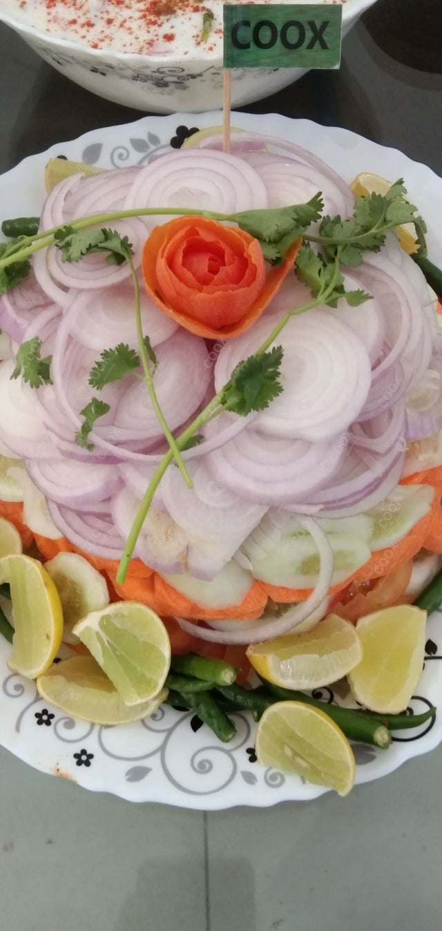 Delicious Salad, Raita, Papad prepared by COOX