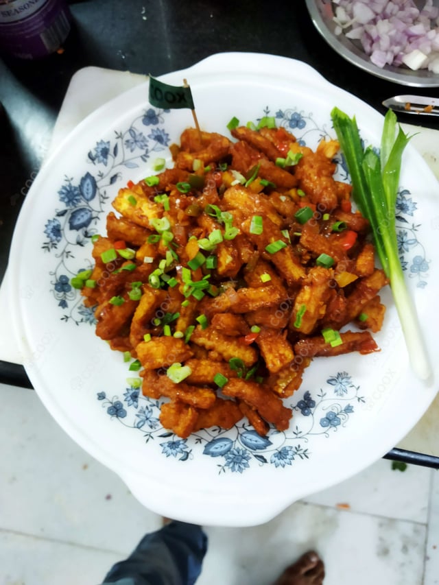 Delicious Crispy Chilly Baby Corn prepared by COOX