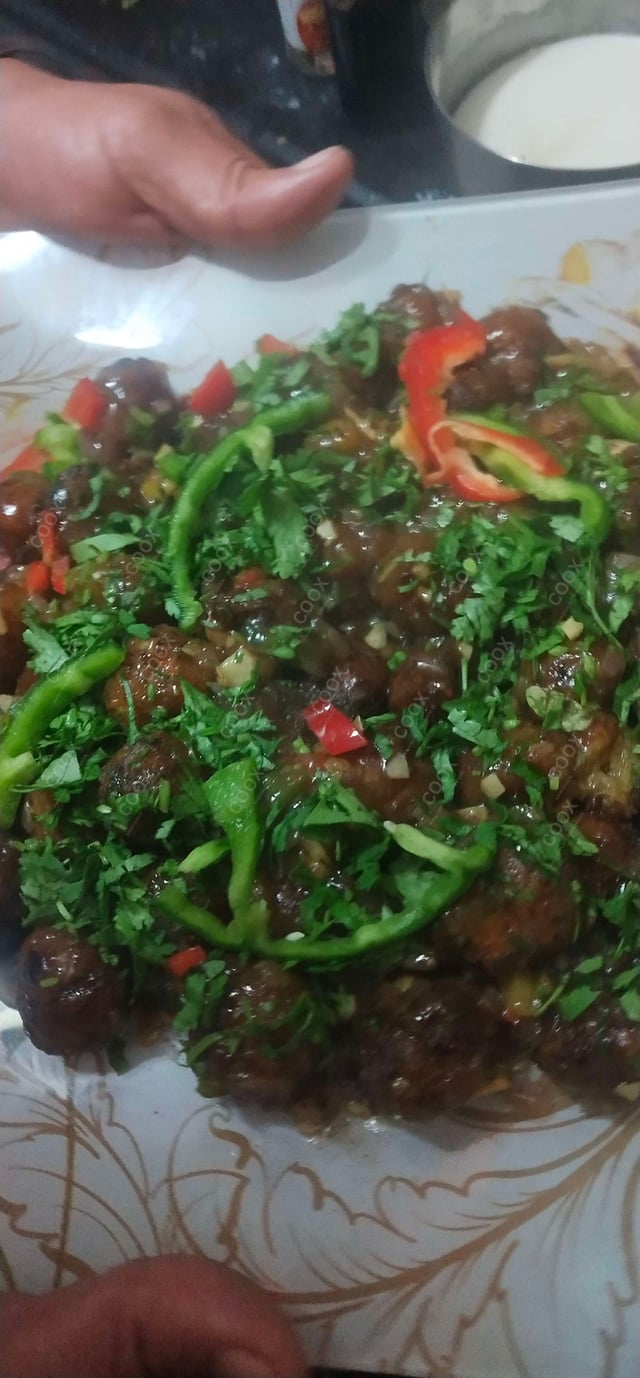 Delicious Veg Manchurian (Dry) prepared by COOX