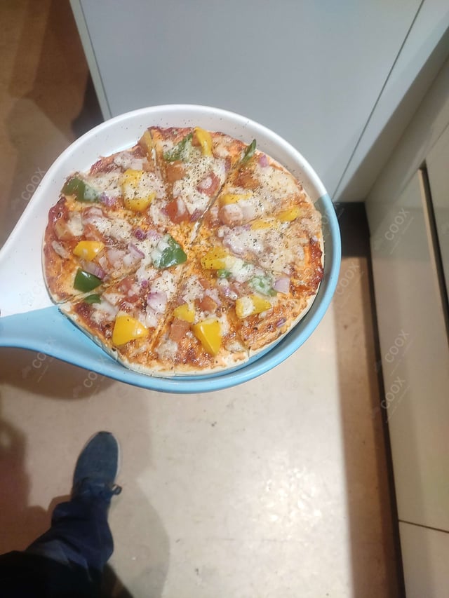 Delicious Chicken Pizza prepared by COOX