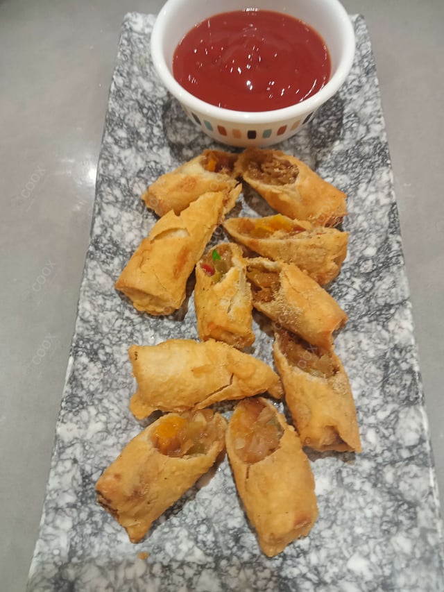 Delicious Veg Spring Rolls prepared by COOX