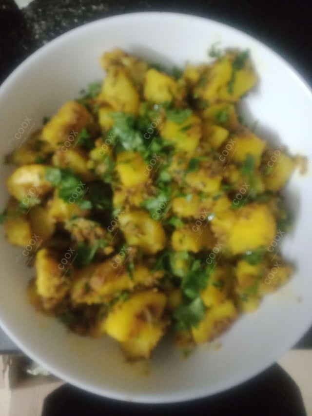 Delicious Jeera Aloo prepared by COOX