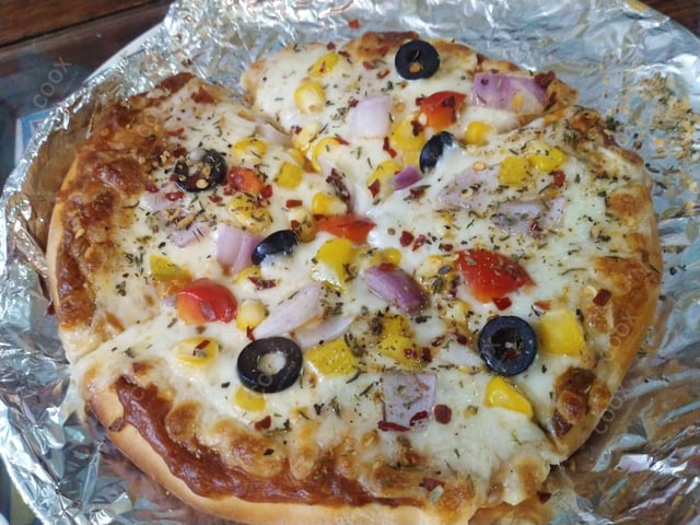 Delicious Veg Pizza prepared by COOX