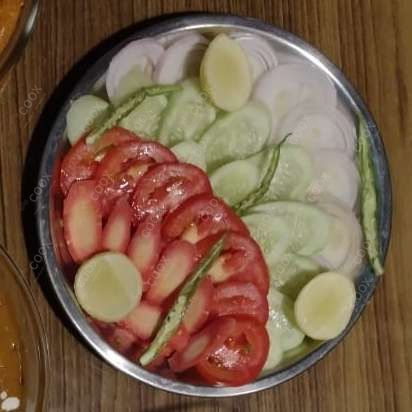 Delicious Salad, Raita, Papad prepared by COOX