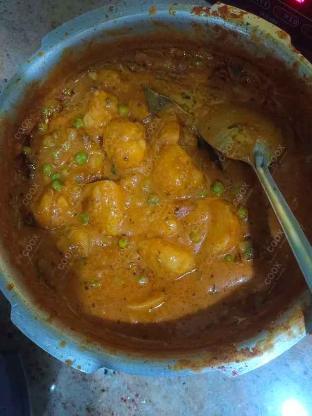 Delicious Dum Aloo prepared by COOX