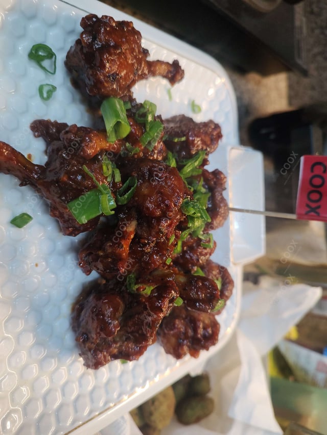 Delicious Chicken Lollipop prepared by COOX