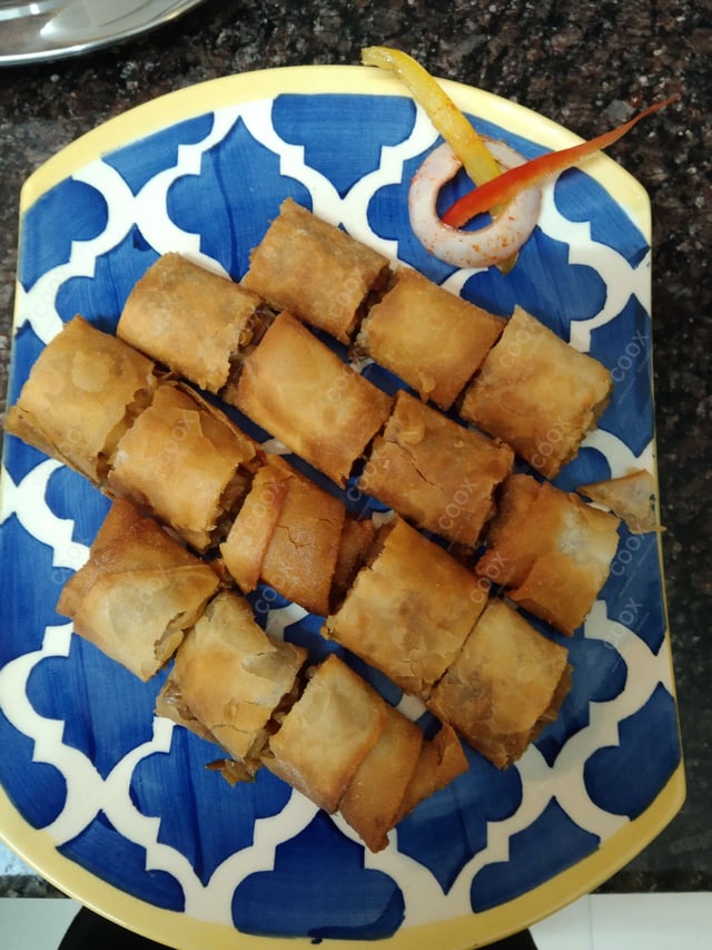 Delicious Veg Spring Rolls prepared by COOX