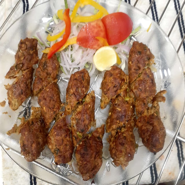 Delicious Mutton Seekh Kebab prepared by COOX