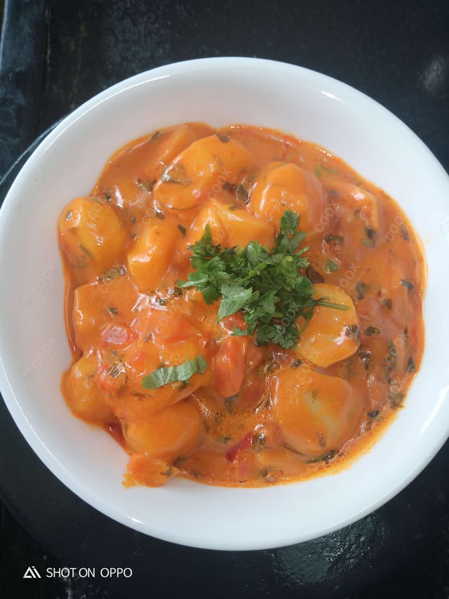 Delicious Dum Aloo prepared by COOX