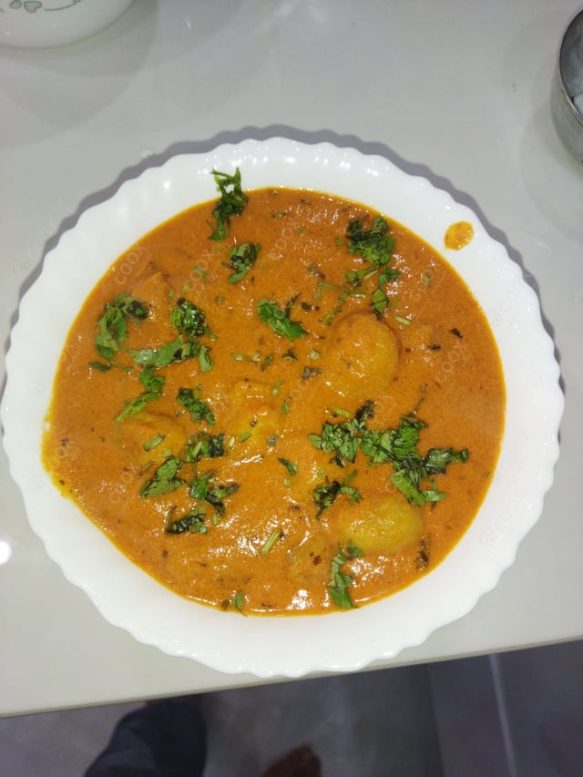 Delicious Dum Aloo prepared by COOX