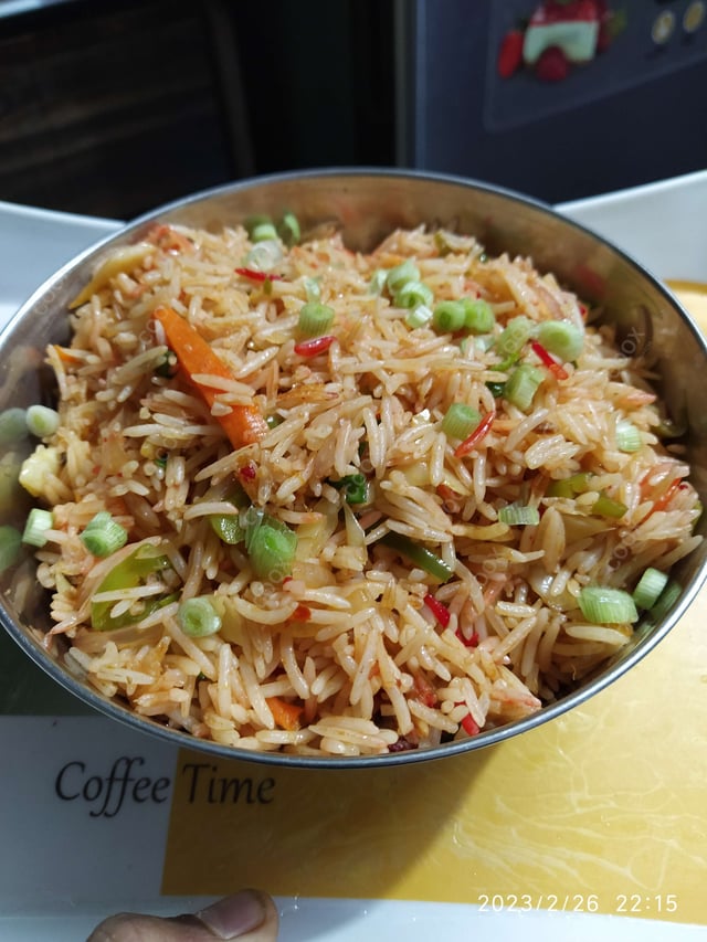 Delicious Schezwan Fried Rice prepared by COOX