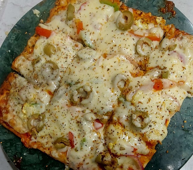 Delicious Veg Pizza prepared by COOX