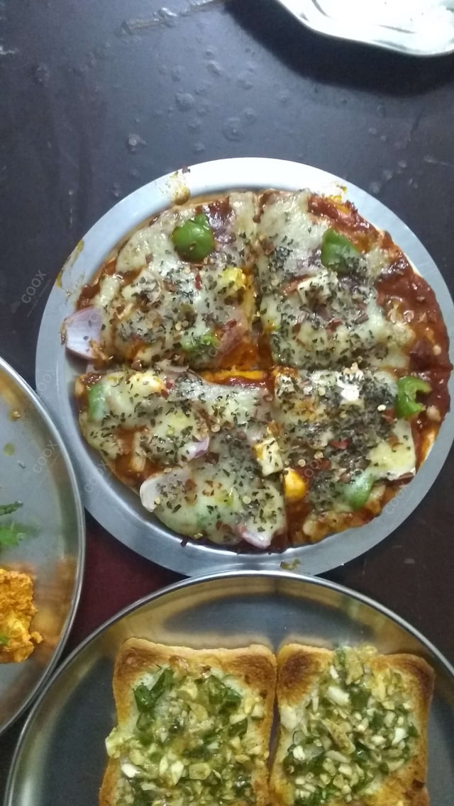 Delicious Veg Pizza prepared by COOX