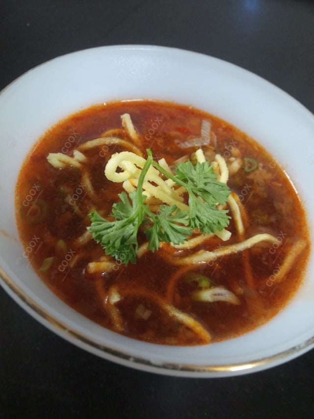 Delicious Vegetable Manchow Soup prepared by COOX