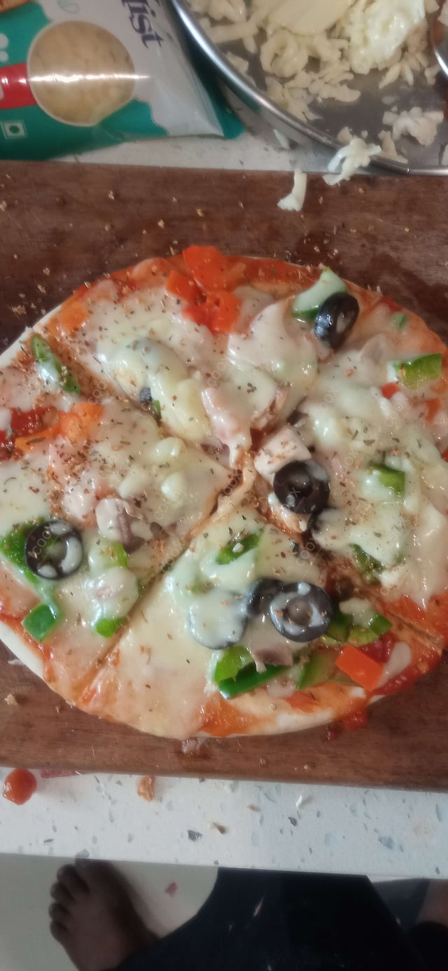 Delicious Veg Pizza prepared by COOX