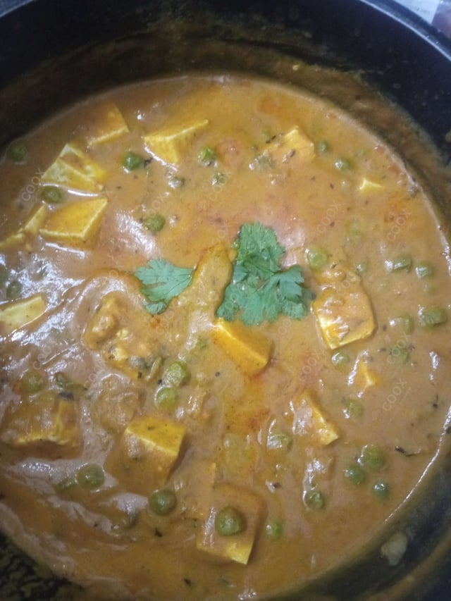 Delicious Matar Paneer prepared by COOX