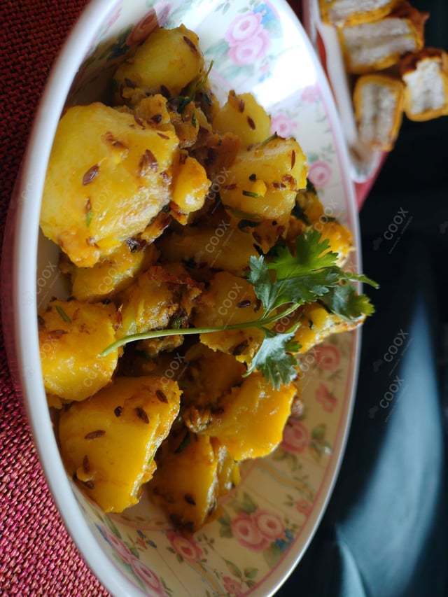 Delicious Jeera Aloo prepared by COOX