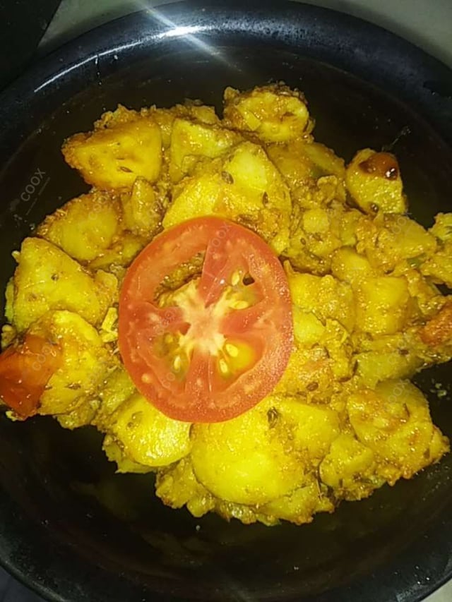 Delicious Jeera Aloo prepared by COOX