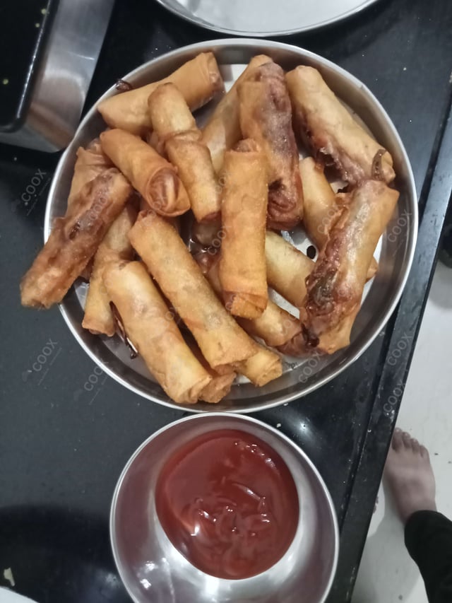 Delicious Veg Spring Rolls prepared by COOX