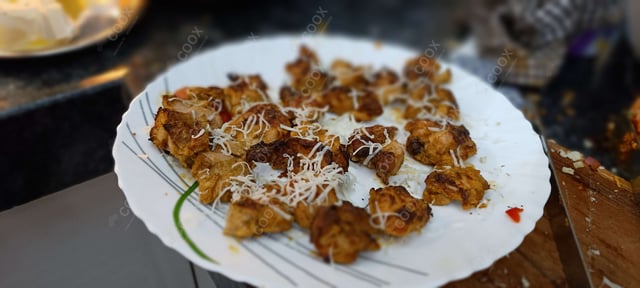 Delicious Murgh Malai Tikka prepared by COOX