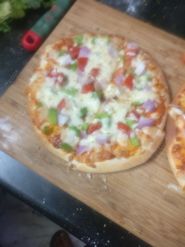 Delicious Veg Pizza prepared by COOX