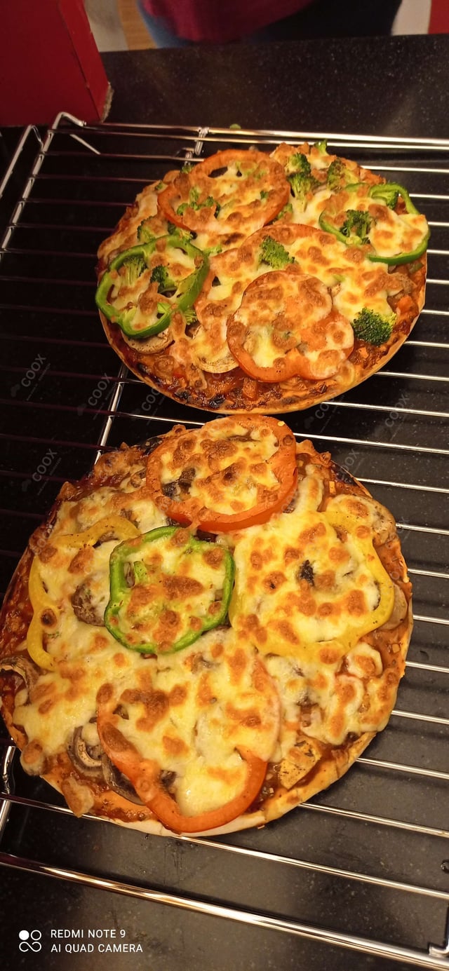 Delicious Veg Pizza prepared by COOX