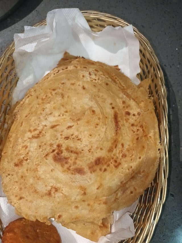 Delicious Lachha Parathas prepared by COOX