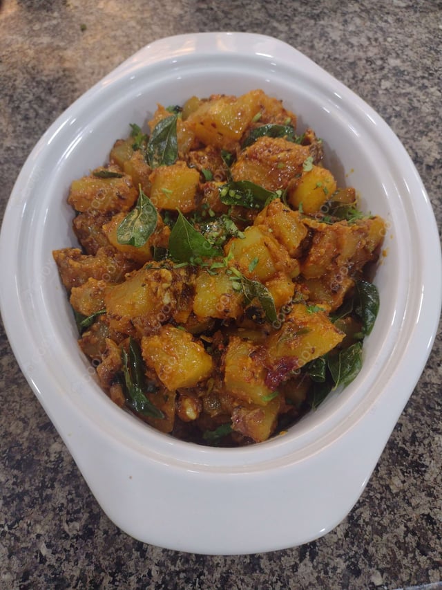 Delicious Jeera Aloo prepared by COOX