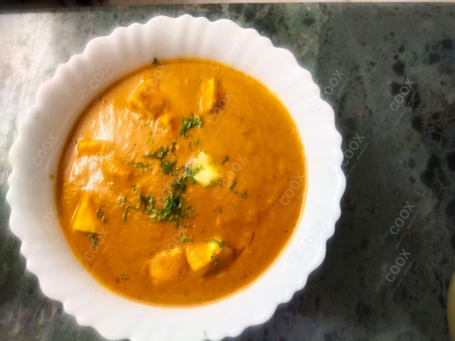 Delicious Paneer Butter Masala prepared by COOX