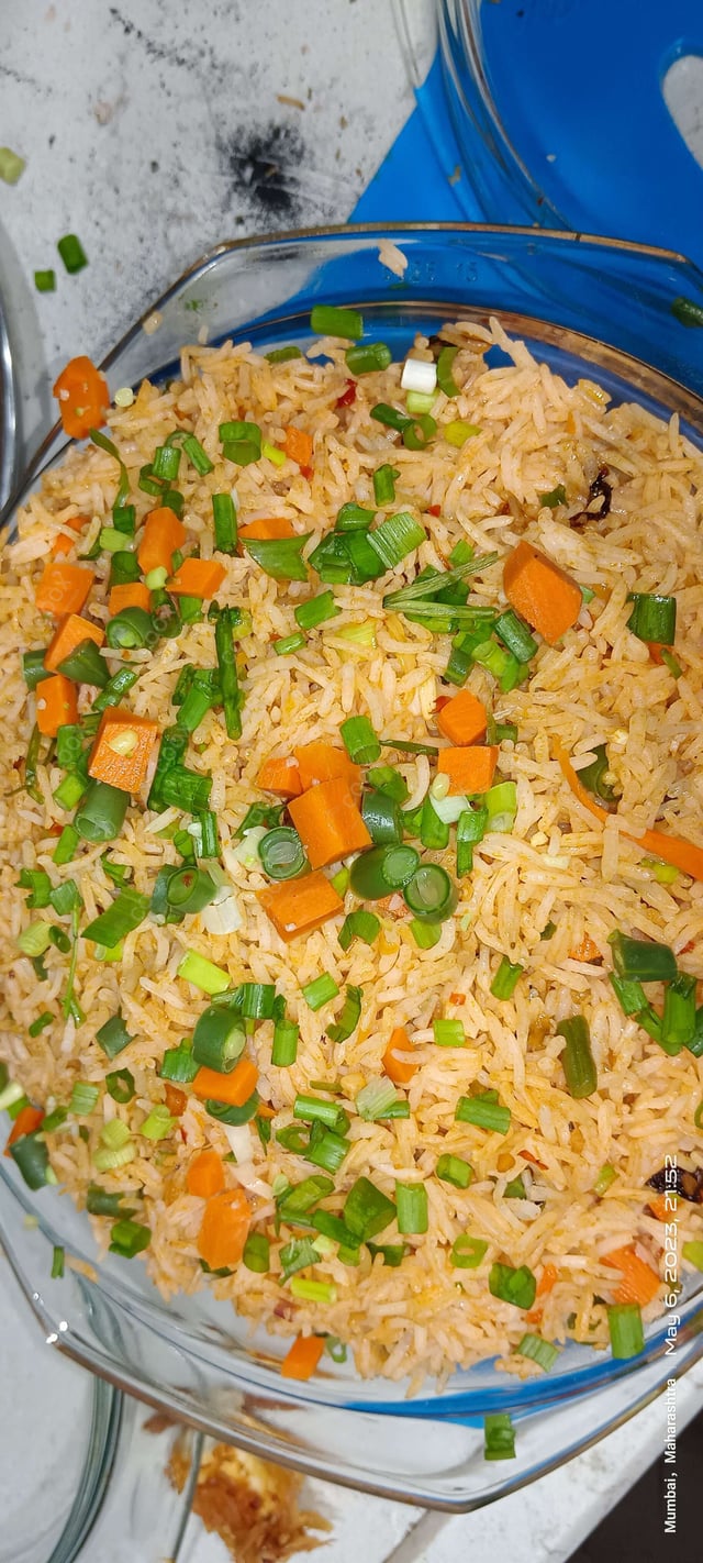 Delicious Schezwan Fried Rice prepared by COOX