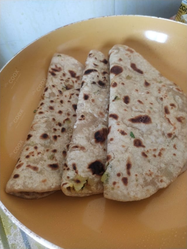 Delicious Stuffed Parathas prepared by COOX