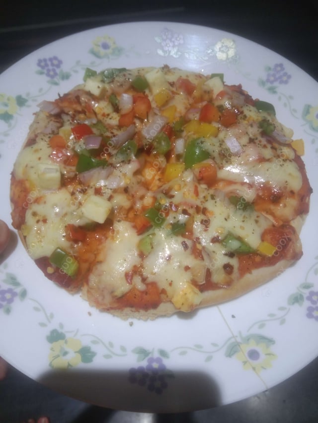 Delicious Veg Pizza prepared by COOX