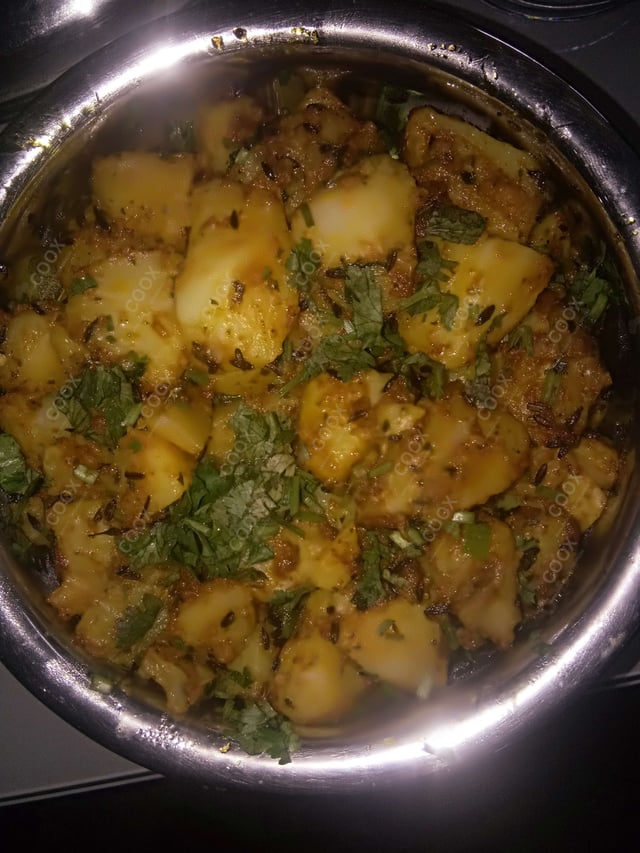 Delicious Jeera Aloo prepared by COOX