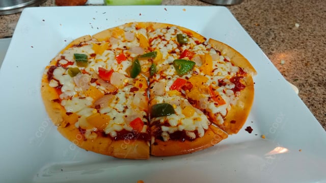 Delicious Veg Pizza prepared by COOX