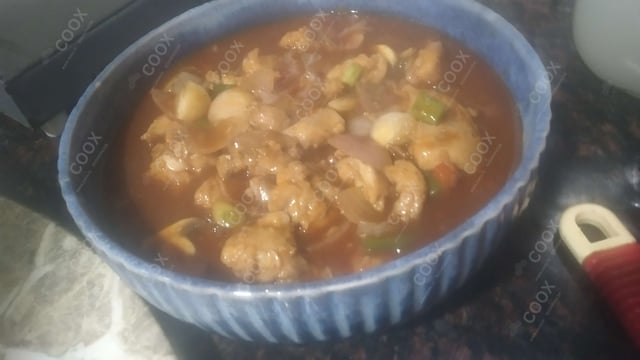 Delicious Chicken in Schezwan Sauce prepared by COOX