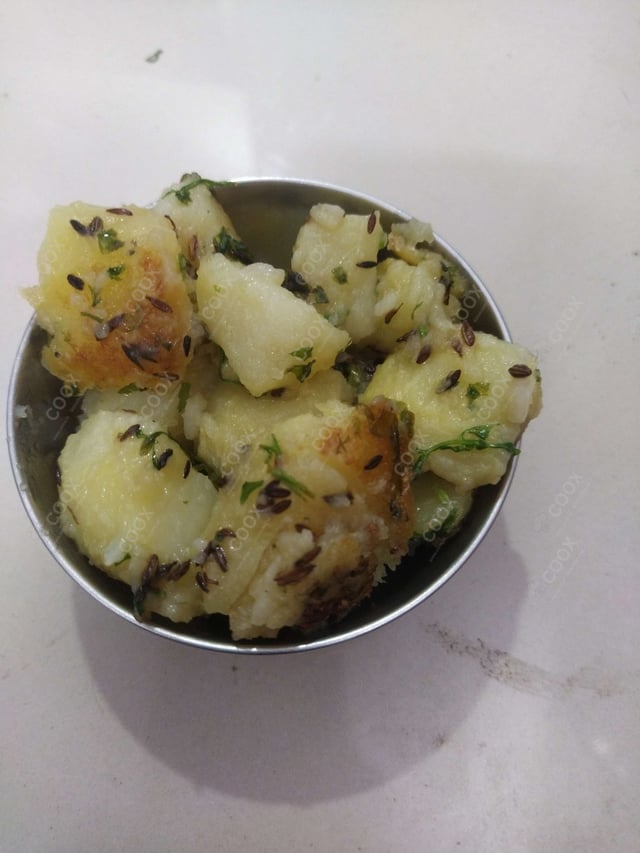 Delicious Jeera Aloo prepared by COOX