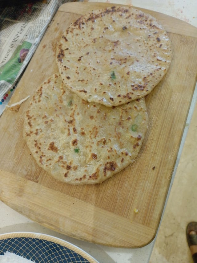 Delicious Stuffed Parathas prepared by COOX