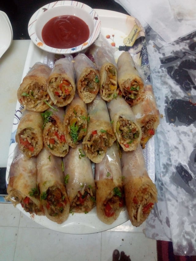 Delicious Veg Spring Rolls prepared by COOX