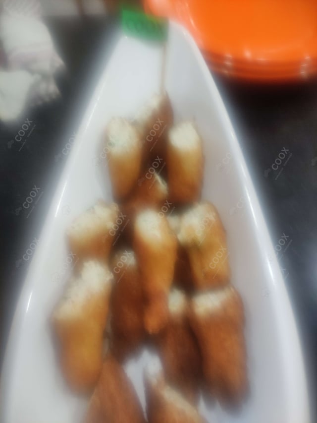 Delicious Veg Spring Rolls prepared by COOX