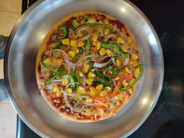 Delicious Veg Pizza prepared by COOX