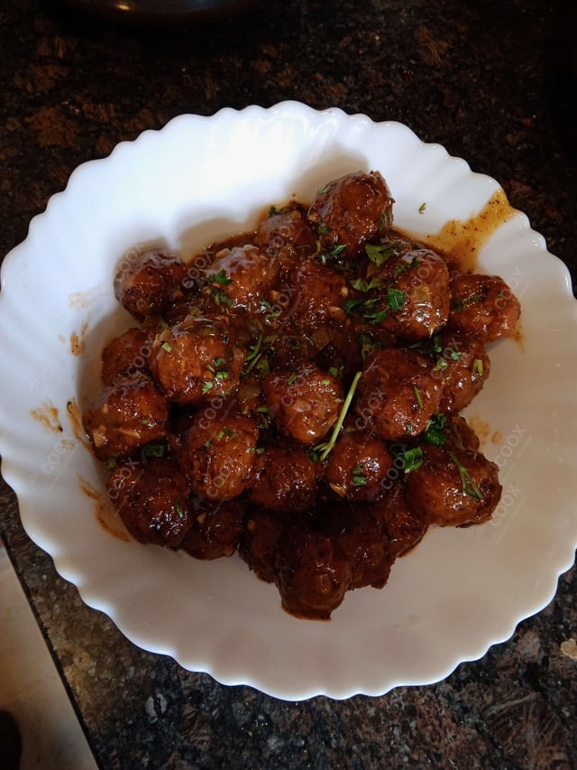 Delicious Veg Manchurian (Dry) prepared by COOX