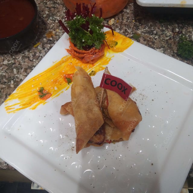 Delicious Chicken Spring Rolls prepared by COOX