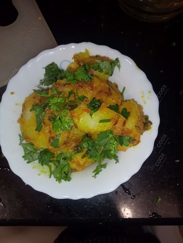 Delicious Jeera Aloo prepared by COOX