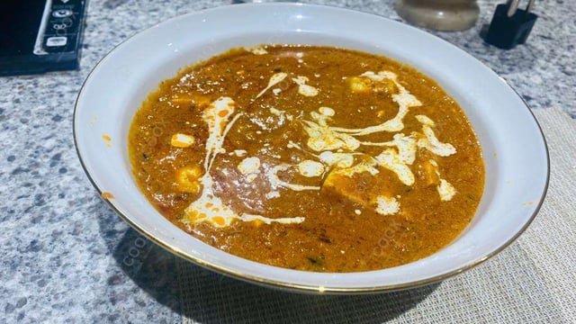 Delicious Paneer Butter Masala prepared by COOX