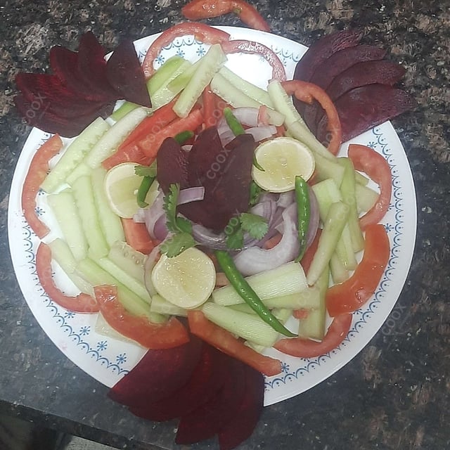 Delicious Salad, Raita, Papad prepared by COOX