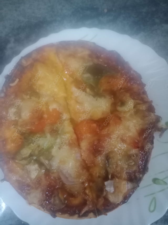 Delicious Veg Pizza prepared by COOX