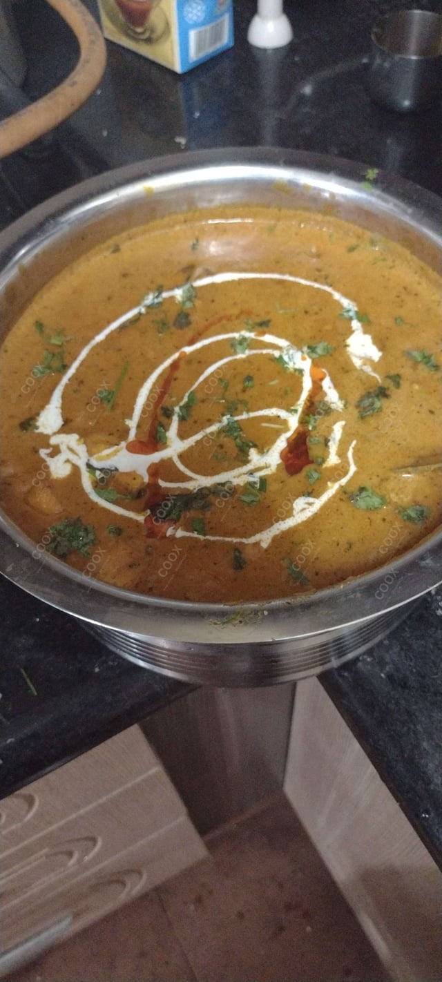 Delicious Paneer Butter Masala prepared by COOX