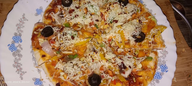 Delicious Veg Pizza prepared by COOX